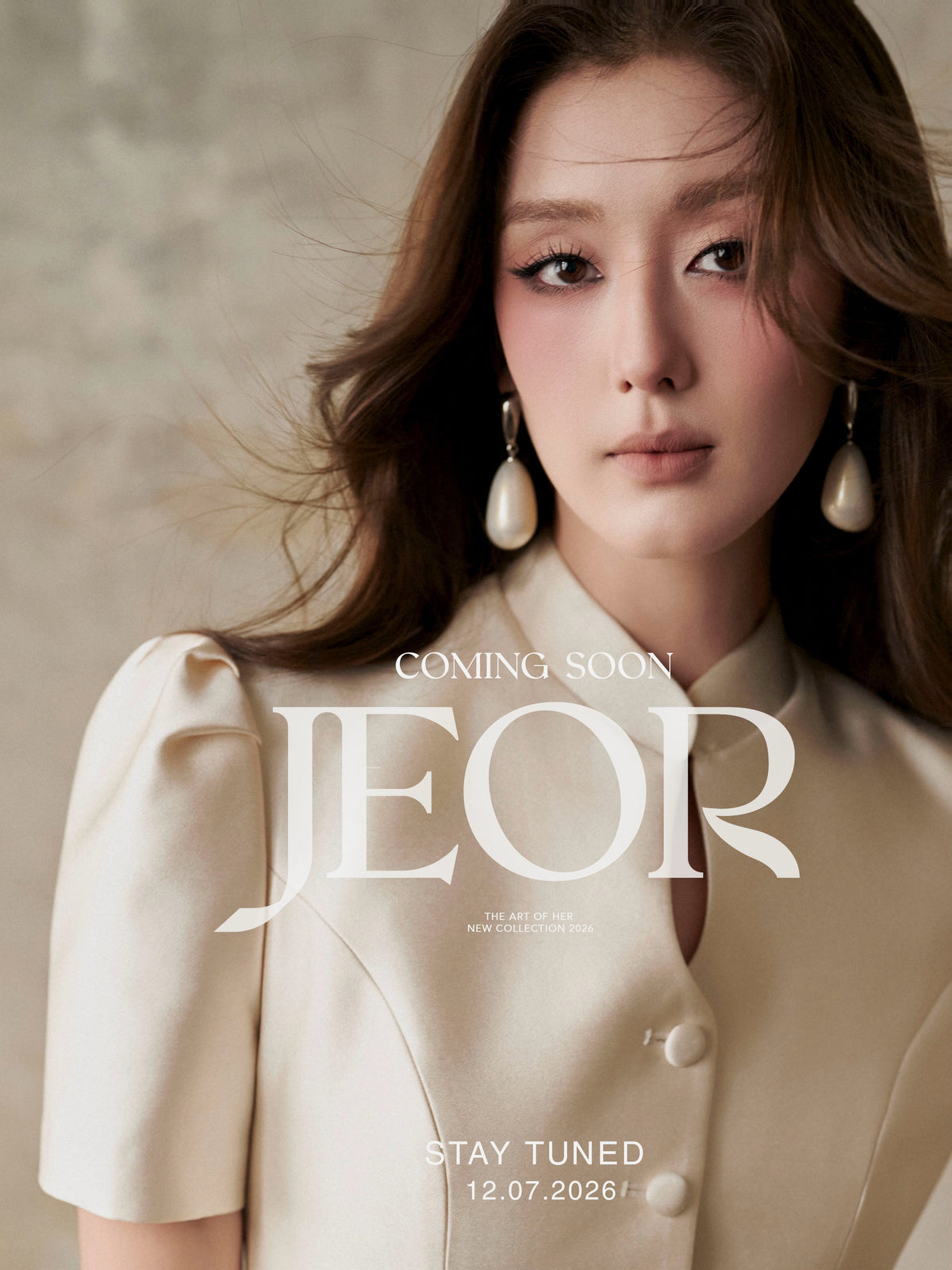 JEOR - The Art of Her, model in an ivory puff-sleeve blazer